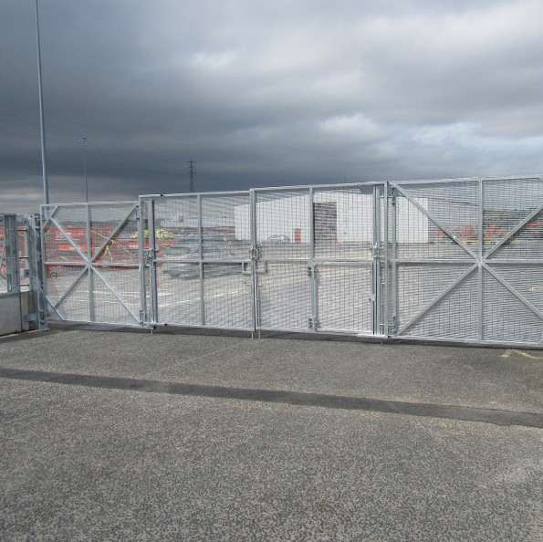 On Ground Bi-Fold Vehicle Gates